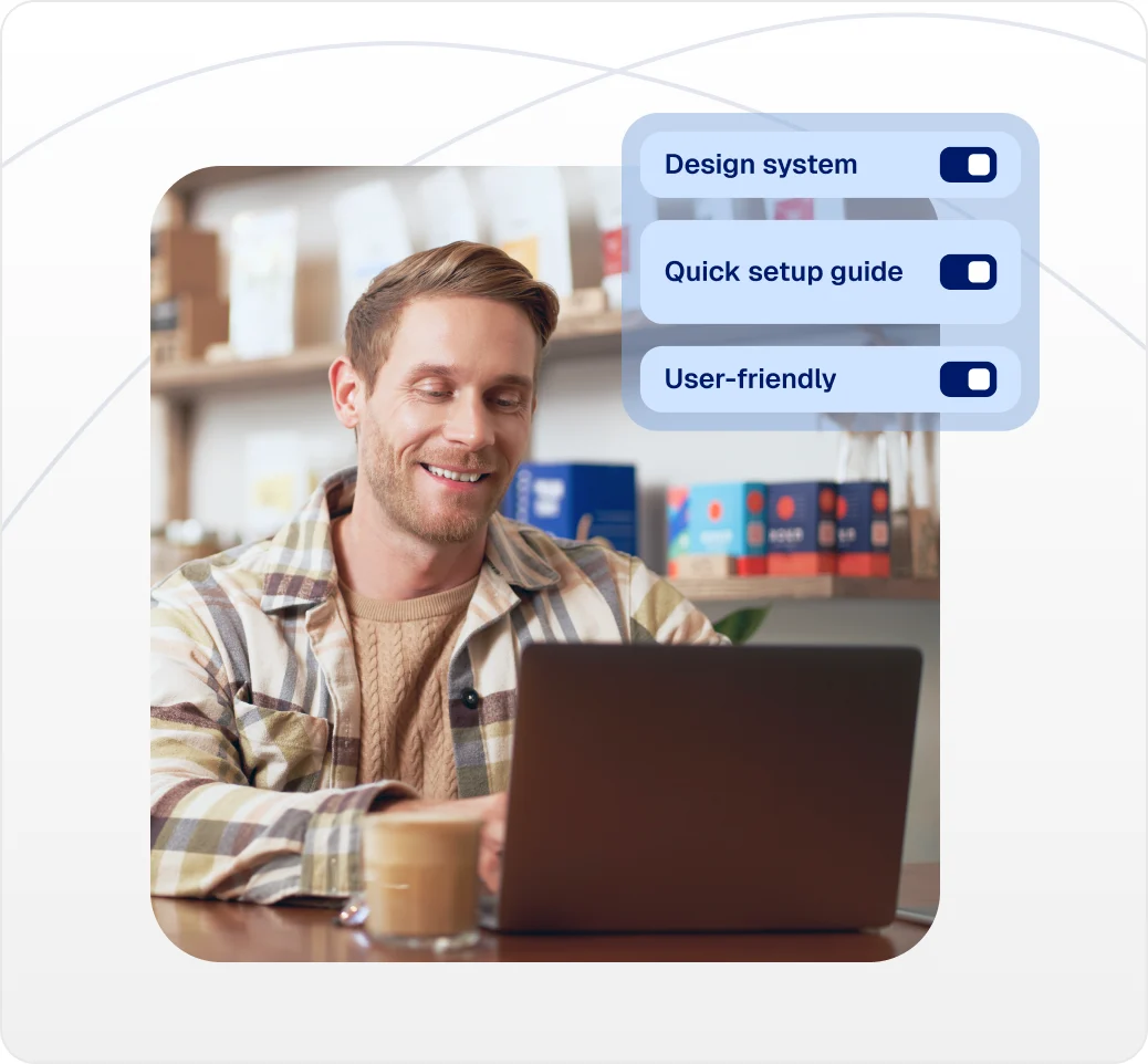 Merchant at a laptop beside a design system, setup guide, and user-friendly settings
